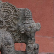 Statue of an Indian god, winged crosier symbol